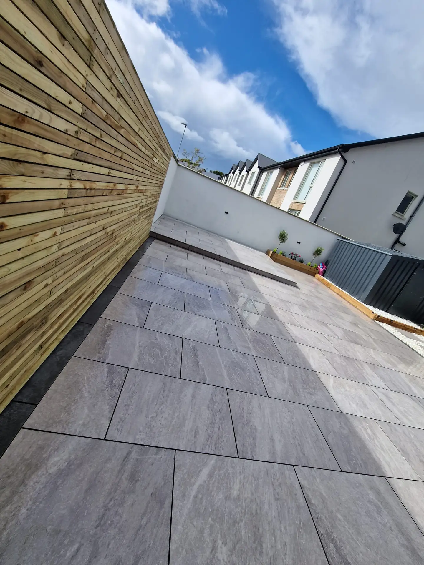 Modern timber fencing with large-format patio slabs in a residential Clare backyard